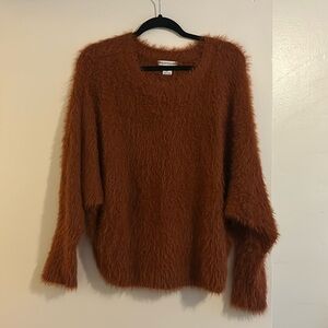 Burnt orange/brown fuzzy sweater. Size large. Super soft and cozy.